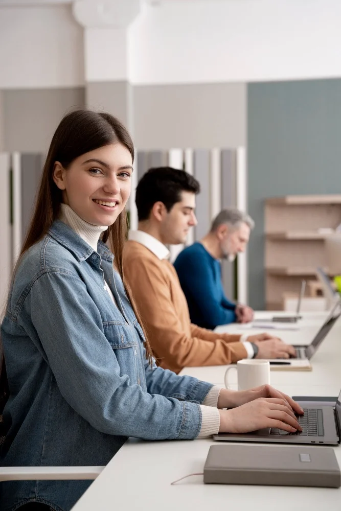 University students working on laptops